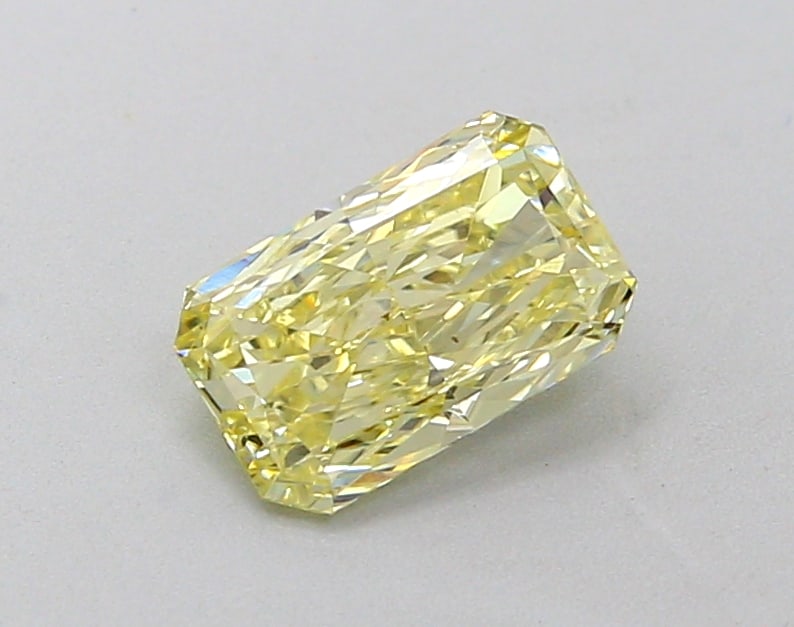 0.79 Lab Grown Diamond FANCY INTENSE YELLOW RADIANT Shape: A refined a 0.79 ct lab-grown diamond in Fancy Intense Yellow, cut with a modern radiant outline. Well-suited to a statement ring, this stone delivers rich color depth with strong visual presence and