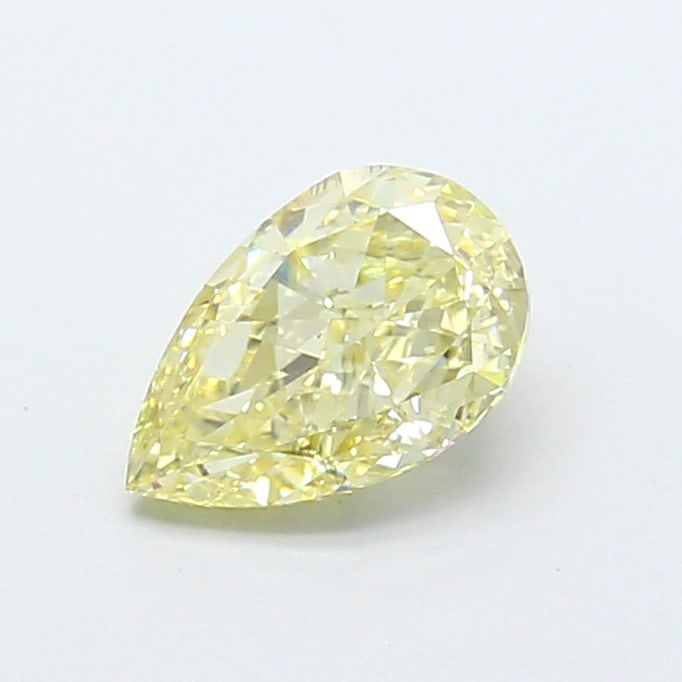 0.95 Lab Grown Diamond FANCY YELLOW PEAR Shape: Offered here is a 0.95 ct lab-grown diamond in Fancy Yellow, cut with a graceful teardrop profile. Ready to set in a halo setting, this stone delivers a pleasing color presence with bright life and a