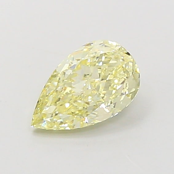 0.98 Lab Grown Diamond FANCY LIGHT YELLOW PEAR Shape: An elegant a 0.98 ct lab-grown diamond in Fancy Light Yellow, cut with an elongated teardrop silhouette. Crafted to elevate a three-stone ring, this stone delivers a soft, luminous tone with a refined
