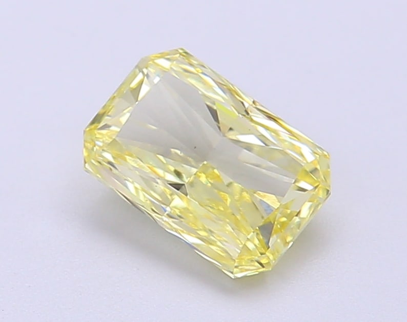 1.4 Lab Grown Diamond FANCY VIVID YELLOW RADIANT Shape: A beautifully crafted a 1.40 ct lab-grown diamond in Fancy Vivid Yellow, cut with crisp facets with vivid sparkle. Designed for a vintage-inspired design, this stone delivers high-saturation color tha