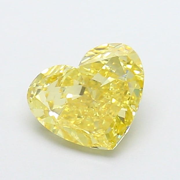2.07 Lab Grown Diamond FANCY VIVID YELLOW HEART Shape: An elegant a 2.07 ct lab-grown diamond in Fancy Vivid Yellow, cut with a balanced heart shape with sweet appeal. Crafted to elevate a three-stone ring, this stone delivers high-saturation color that s