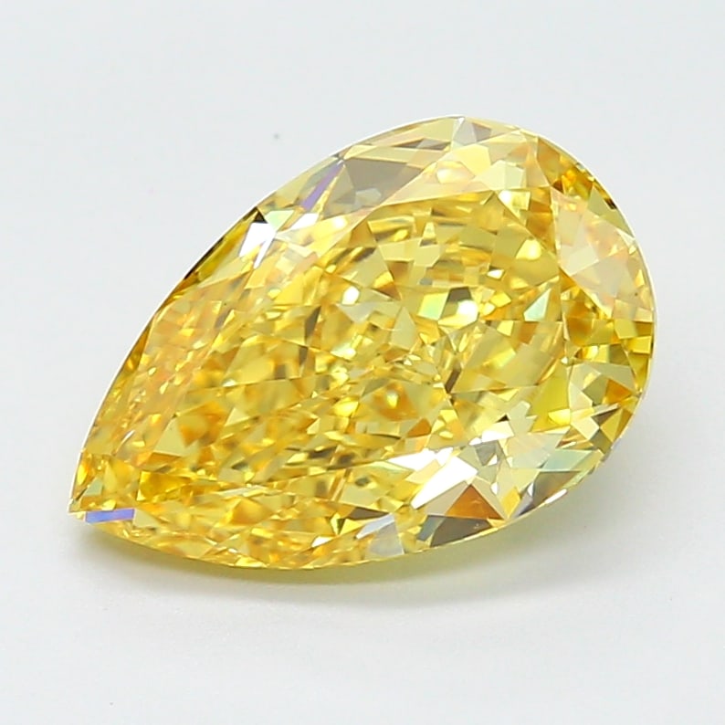 4.7 Lab Grown Diamond FANCY VIVID ORANGY YELLOW PEAR Shape: An elegant a 4.70 ct lab-grown diamond in Fancy Vivid Orangy Yellow, cut with an elongated teardrop silhouette. Crafted to elevate a three-stone ring, this stone delivers high-saturation color that st