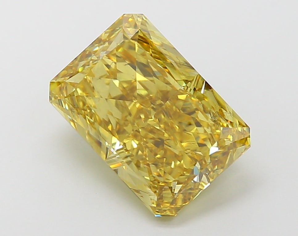 4.76 Lab Grown Diamond FANCY VIVID YELLOW RADIANT Shape: A striking a 4.76 ct lab-grown diamond in Fancy Vivid Yellow, cut with a brilliant radiant profile. Perfect for a modern bespoke piece, this stone delivers high-saturation color that stands out beauti