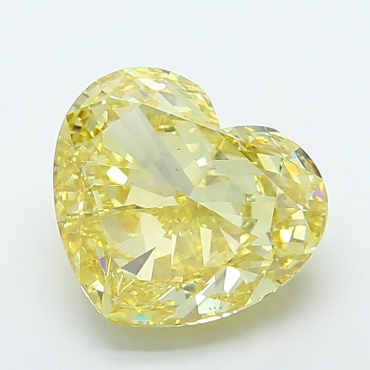6.35 Lab Grown Diamond FANCY VIVID YELLOW HEART Shape: Presenting a 6.35 ct lab-grown diamond in Fancy Vivid Yellow, cut with a romantic heart silhouette. Pairs beautifully with a earring drops, this stone delivers high-saturation color that stands out be