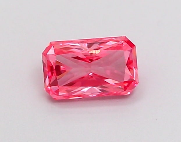 0.43 Lab Grown Diamond FANCY VIVID PINK RADIANT Shape: A striking a 0.43 ct lab-grown diamond in Fancy Vivid Pink, cut with a modern radiant outline. Perfect for a modern bespoke piece, this stone delivers high-saturation color that stands out beautifully