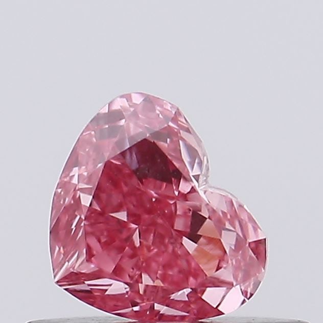 0.45 Lab Grown Diamond FANCY VIVID PINK HEART Shape: Presenting a 0.45 ct lab-grown diamond in Fancy Vivid Pink, cut with a balanced heart shape with sweet appeal. Pairs beautifully with a earring drops, this stone delivers high-saturation color that st