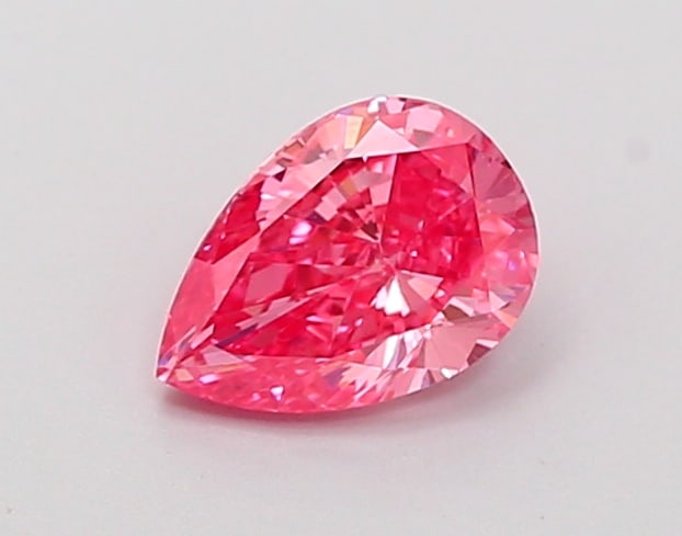 0.49 Lab Grown Diamond FANCY VIVID PINK PEAR Shape: A striking a 0.49 ct lab-grown diamond in Fancy Vivid Pink, cut with a classic pear outline with a tapered tip. Perfect for a modern bespoke piece, this stone delivers high-saturation color that stand
