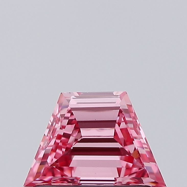 0.52 Lab Grown Diamond FANCY VIVID PINK TRAPEZOID Shape: Showcasing a 0.52 ct lab-grown diamond in Fancy Vivid Pink, cut with a structured trapezoid profile. Ideal for a solitaire ring, this stone delivers high-saturation color that stands out beautifully a