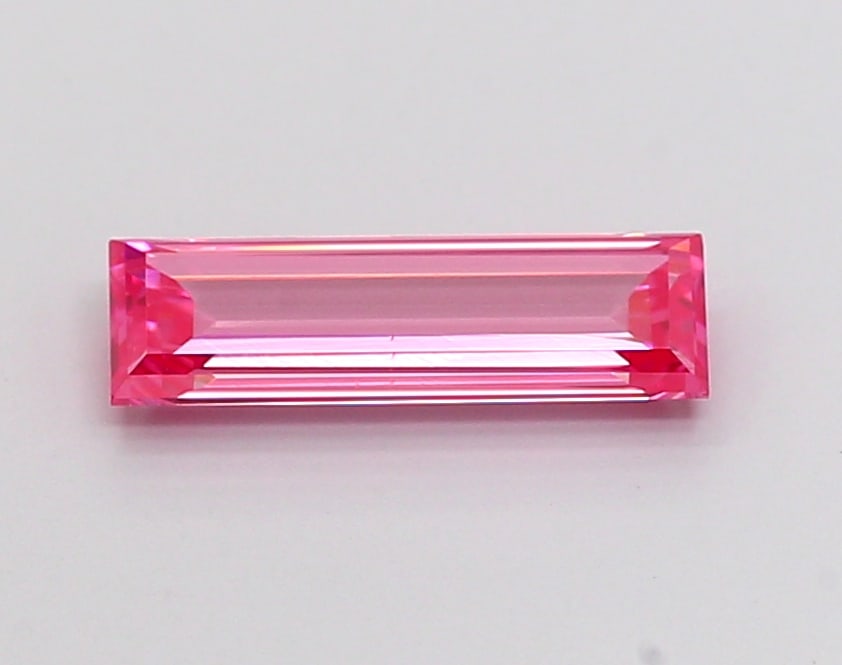 0.68 Lab Grown Diamond FANCY VIVID PINK BAGUETTE Shape: Offered here is a 0.68 ct lab-grown diamond in Fancy Vivid Pink, cut with a crisp baguette silhouette. Ready to set in a halo setting, this stone delivers high-saturation color that stands out beautif
