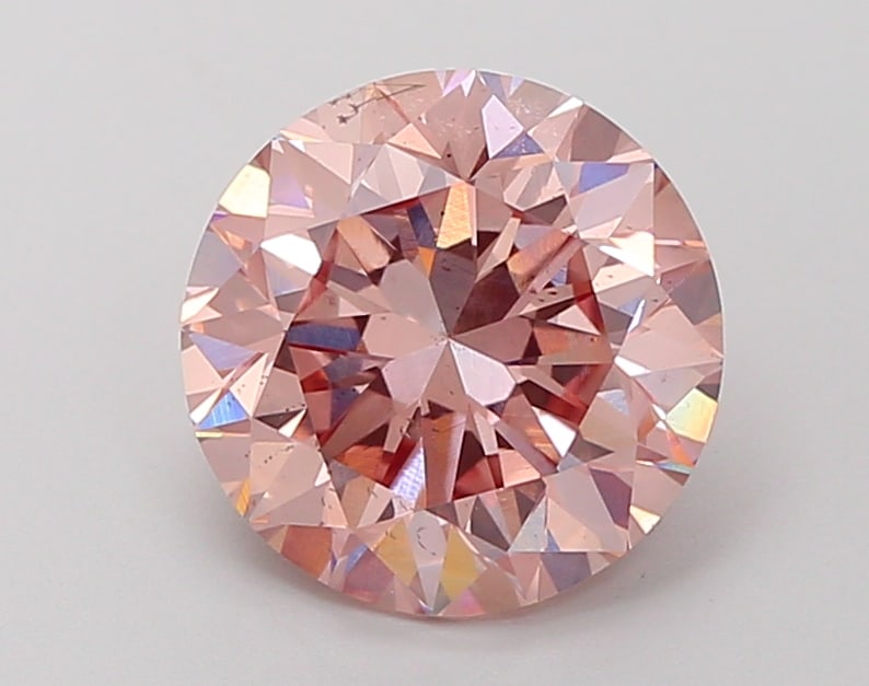 3.24 Lab Grown Diamond FANCY INTENSE PINK ROUND Shape: A refined a 3.24 ct lab-grown diamond in Fancy Intense Pink, cut with classic round brilliance. Well-suited to a statement ring, this stone delivers rich color depth with strong visual presence and a