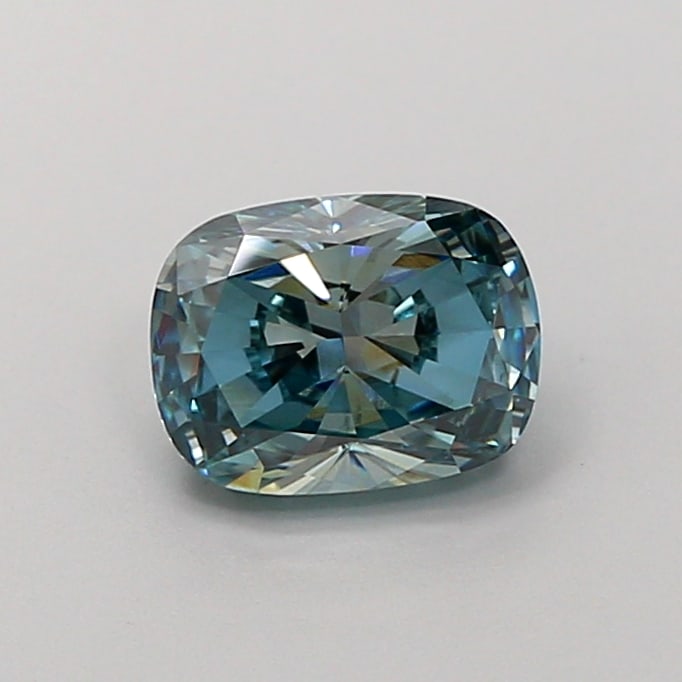1.44 Lab Grown Diamond FANCY VIVID BLUE CUSHION Shape: A standout a 1.44 ct lab-grown diamond in Fancy Vivid Blue, cut with a pillowy cushion silhouette. Made to shine in a side-stone layout, this stone delivers high-saturation color that stands out beaut