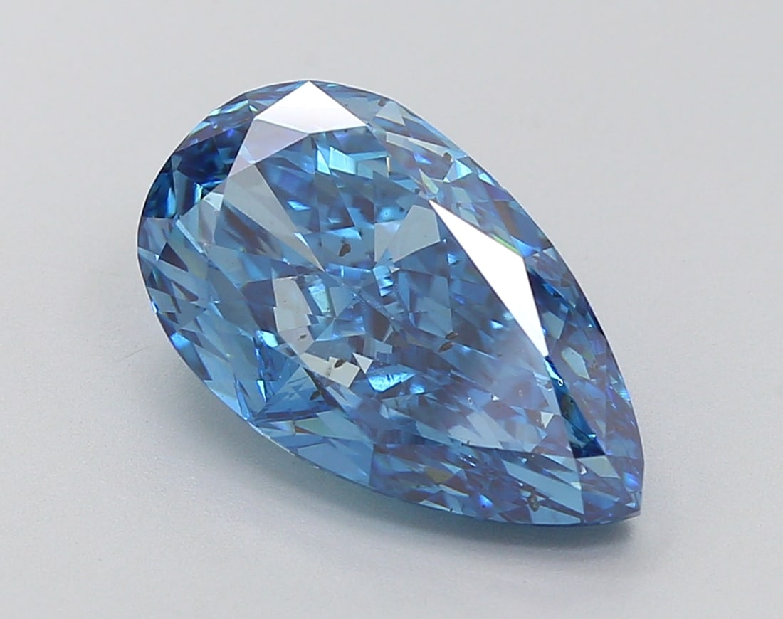 4.96 Lab Grown Diamond FANCY VIVID BLUE PEAR Shape: Featuring a 4.96 ct lab-grown diamond in Fancy Vivid Blue, cut with a graceful teardrop profile. A great choice for a minimalist setting, this stone delivers high-saturation color that stands out beau