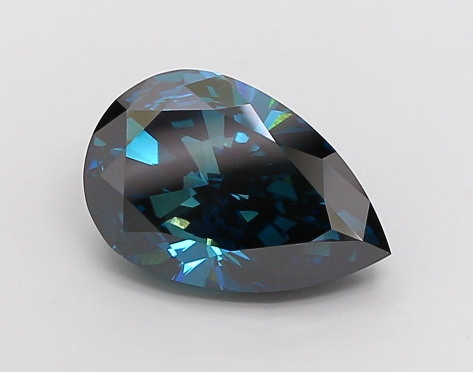 6.09 Lab Grown Diamond FANCY DEEP GREENISH BLUE PEAR Shape: An elegant a 6.09 ct lab-grown diamond in Fancy Deep Greenish Blue, cut with a graceful teardrop profile. Crafted to elevate a three-stone ring, this stone delivers a deeper tone with dramatic, luxuri