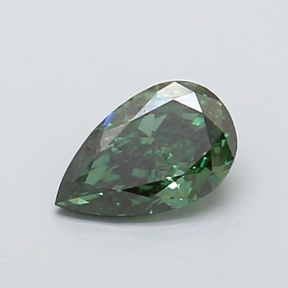 0.54 Lab Grown Diamond FANCY VIVID GREEN PEAR Shape: Offered here is a 0.54 ct lab-grown diamond in Fancy Vivid Green, cut with a classic pear outline with a tapered tip. Ready to set in a halo setting, this stone delivers high-saturation color that sta