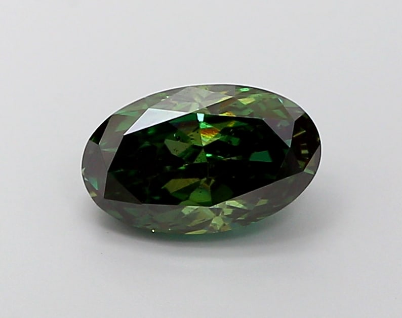 1.97 Lab Grown Diamond FANCY DEEP GREEN OVAL Shape: Featuring a 1.97 ct lab-grown diamond in Fancy Deep Green, cut with an elongated oval silhouette. A great choice for a minimalist setting, this stone delivers a deeper tone with dramatic, luxurious im