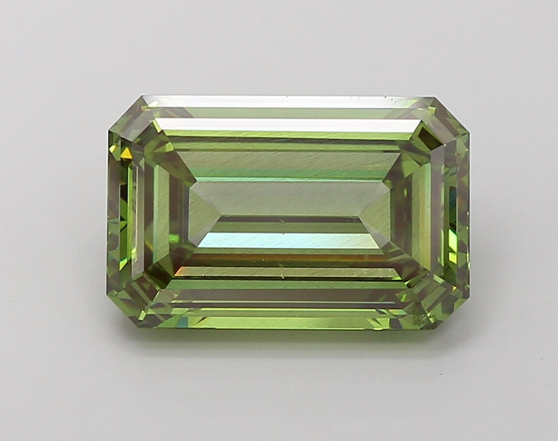 5.92 Lab Grown Diamond FANCY VIVID GREEN EMERALD Shape: Presenting a 5.92 ct lab-grown diamond in Fancy Vivid Green, cut with refined step-faceted elegance. Pairs beautifully with a earring drops, this stone delivers high-saturation color that stands out b