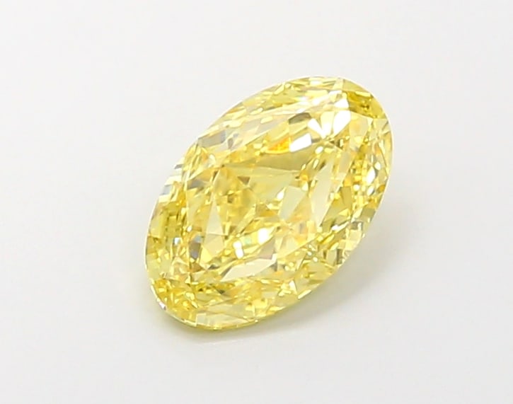 1.75 CTS IGI CERTIFIED LAB GROWN DIAMOND OVAL SHAPE FANCY VIVID YELLOW VS1: IGI Certified lab-grown diamond. An extraordinary Fancy Vivid Yellow oval gem that exudes luxury. At 1.75 carats and VS1 clarity, its bold color saturation and seamless polish make it a collector's ch