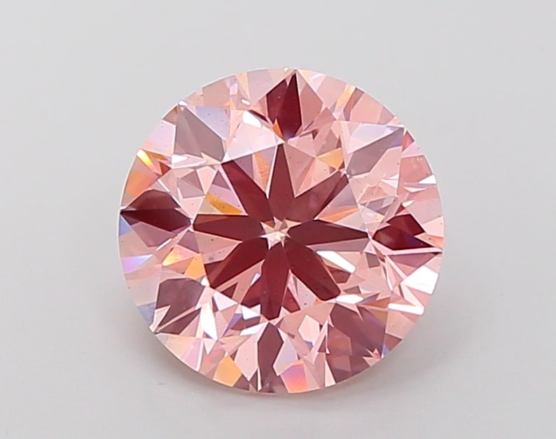 4.22 CTS IGI CERTIFIED LAB GROWN DIAMOND ROUND SHAPE FANCY VIVID PINK SI1: IGI Certified lab-grown diamond. A vibrant 4.22-carat Fancy Vivid Pink round stone representing feminine strength and beauty. Its symmetry and tone create unmatched allure.