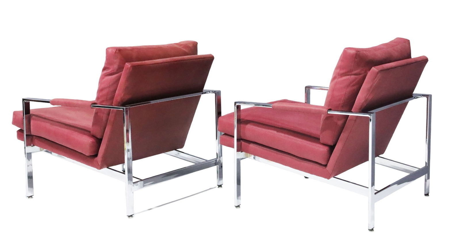 Milo Baughman Chrome Frame Lounge Chairs in Dusty Rose Faux Suede/Leather: Milo Baughman pair of chrome frame lounge chairs in a dusty rose faux suede/leather. Known for their sleek lines and luxurious comfort, these chairs exemplify the mid-century modern aesthetic.