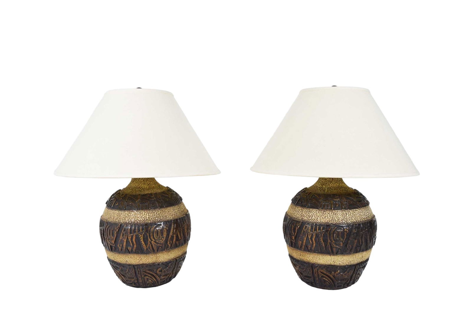 Mid century Brutalist Style Bulbous Ceramic Table Lamps: Expertly crafted in stunning shades of beige, bronze, and brown, these lamps perfectly embody the brutalist style. Ideal for adding a touch of sophistication to any room, their impressive size is meas