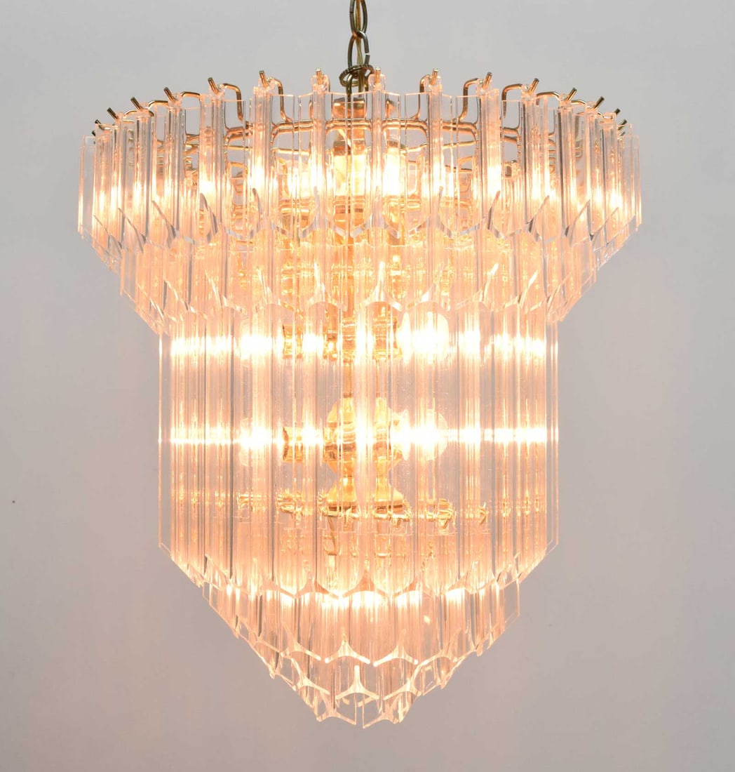 Large Lucite Chandelier, Six Tiers, 1960s: Crafted from very nice lucite, this acrylic chandelier features shimmering acrylic prisms cascading from a wire frame to create a dazzling visual masterpiece. With six tiers illuminating a height of 1