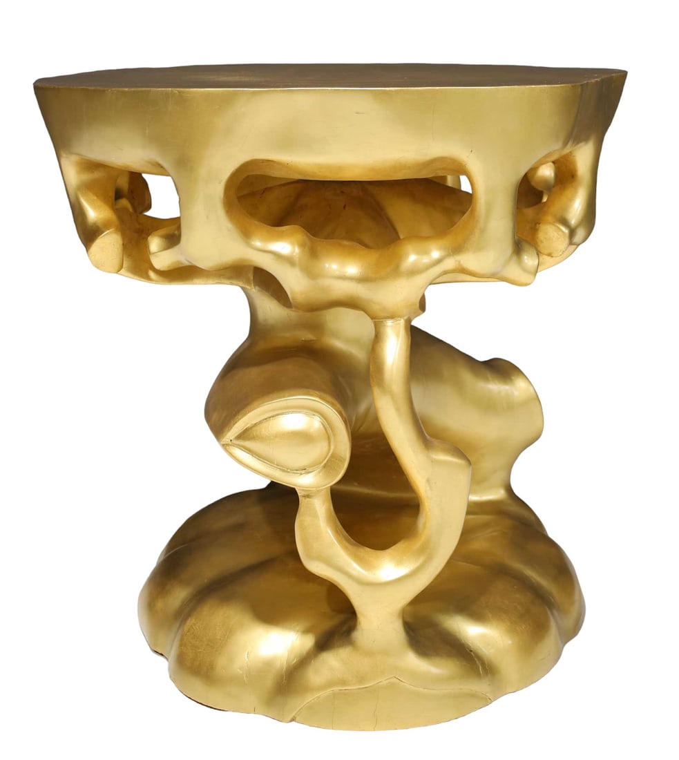 Scala Luxury Gold Leaf Truffle Trunk Table: Scala Luxury Gold Leaf Truffle Trunk Table. This exquisite piece features a hand-carved solid wood trunk, meticulously finished in gold leaf with a sleek gloss top coat. Versatile in function, it can