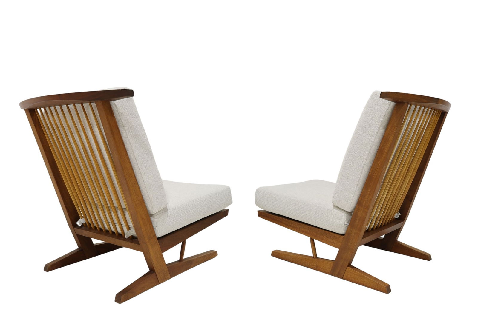 George Nakashima Conoid Lounge Chairs: Crafted by the only authorized manufacturer of Nakashima furniture outside of the United States, Sakura Seisakusho in Takamatsu, Japan. Signed.