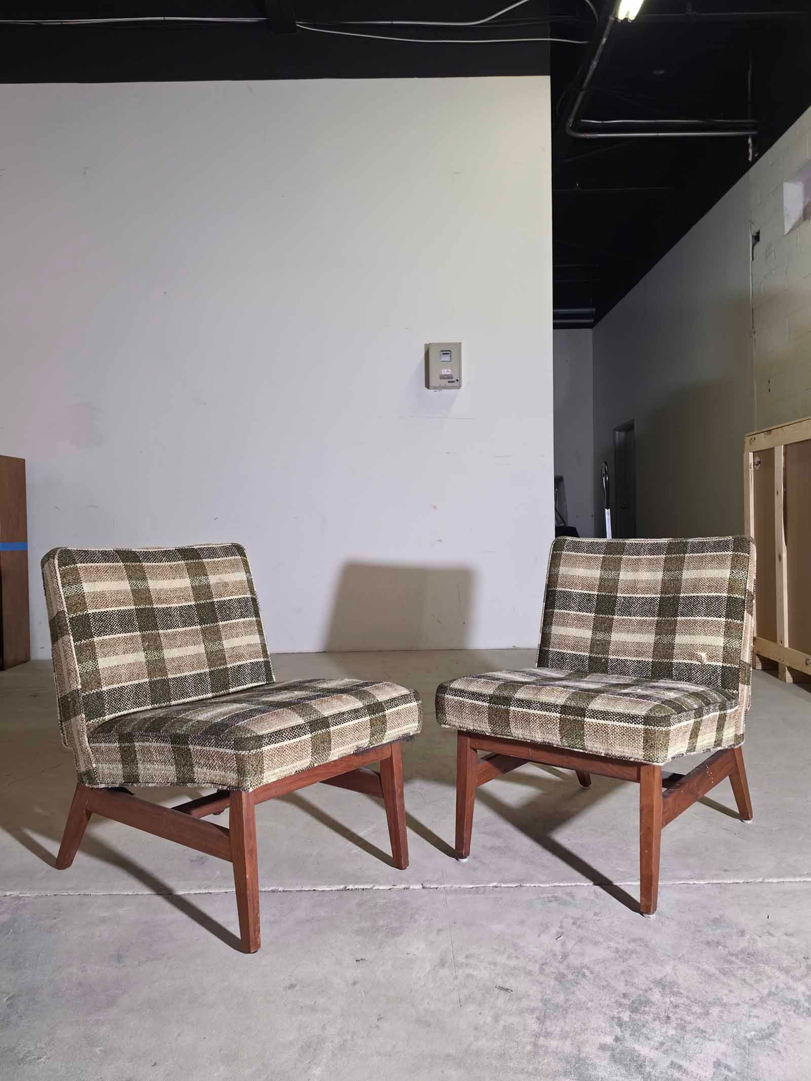 1960s Slipper Chairs in the Style of Jens Risom: Vintage pair of 1960s slipper chairs in the style of Jens Risom, featuring the clean lines and low-profile silhouette that define classic mid-century modern design. These chairs have a simple, elegant