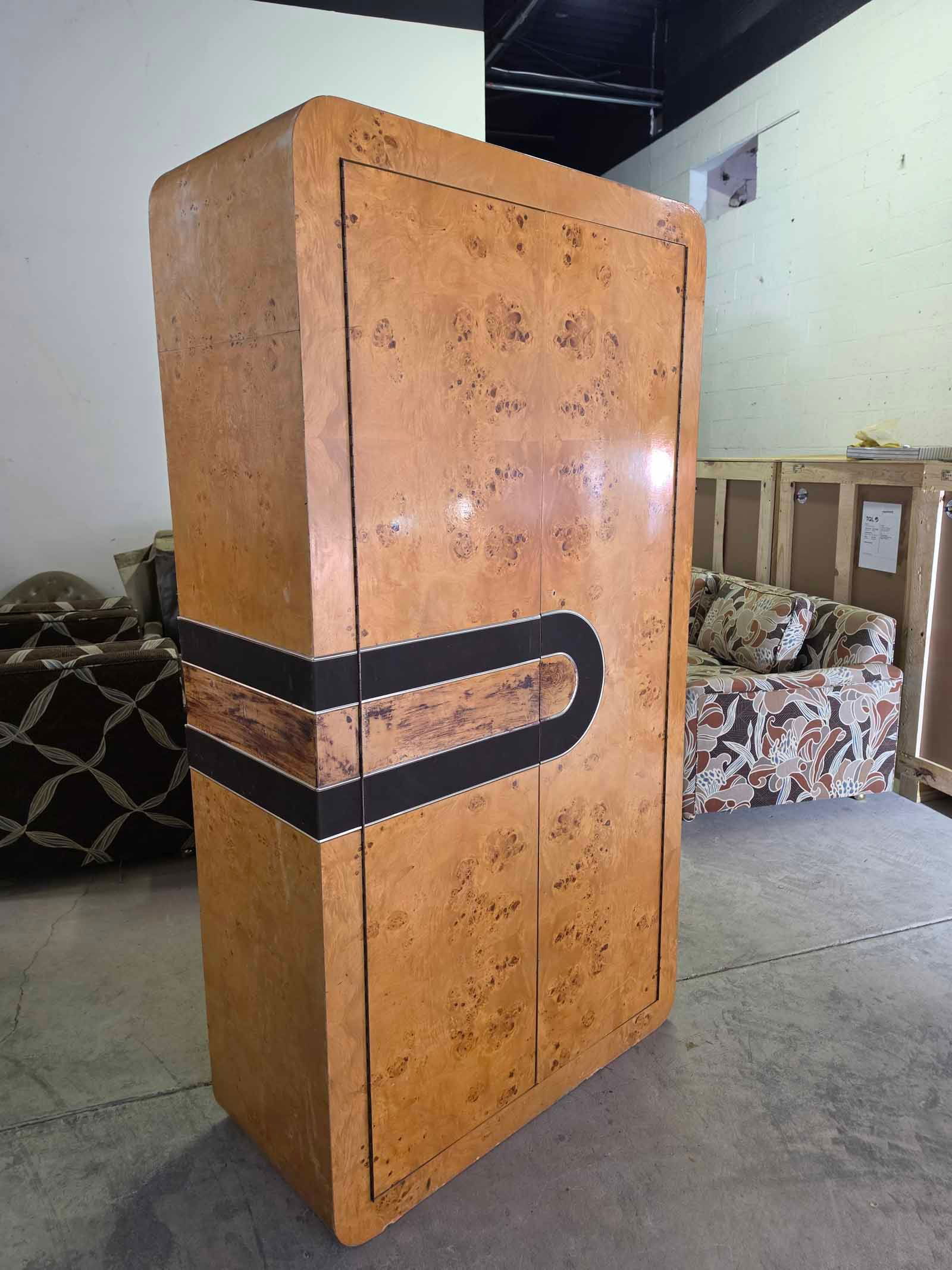 1960s Vintage Cabinet in the Style of Vladimir Kagan: Striking 1960s vintage cabinet in the style of Vladimir Kagan, featuring beautifully curved edges and burlwood veneer. The soft sculptural lines reflect the organic modern aesthetic Kagan became