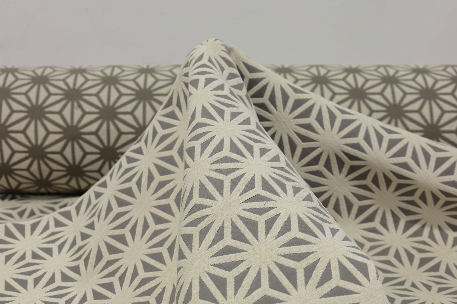 Two Large Bolts of High-Quality Upholstery Fabric in Off-White with Taupe Star Pattern: Fabric is high quality, substantial weight and durability. We do not have exact yardage but about 30 -40 yards. Typical 54" width.