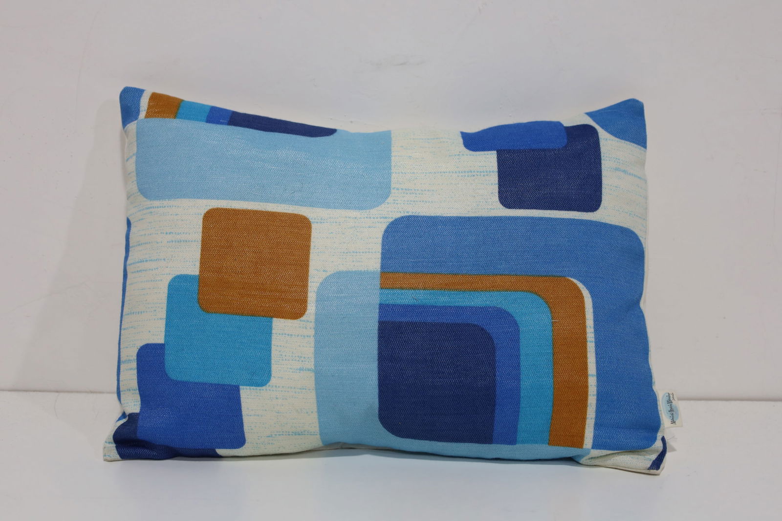 Small Atomic Lumbar Pillow: Featuring a compact rectangular profile and classic mid-century modern motif. Suitable for sofa or chair accent.