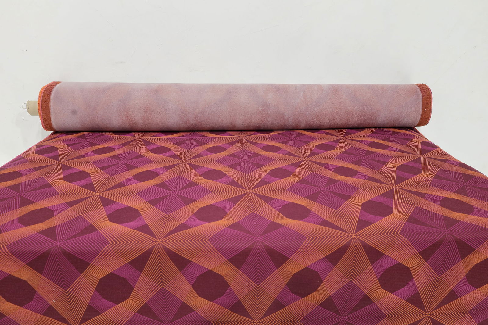 Large Bolt of High Quality Magenta with Geometric Design Upholstery Fabric: A beautiful high-quality geometric print woven fabric in magenta and orange, we do not have exact yardage but estimate at least 20 yards, and likely more. Width is typical 54".