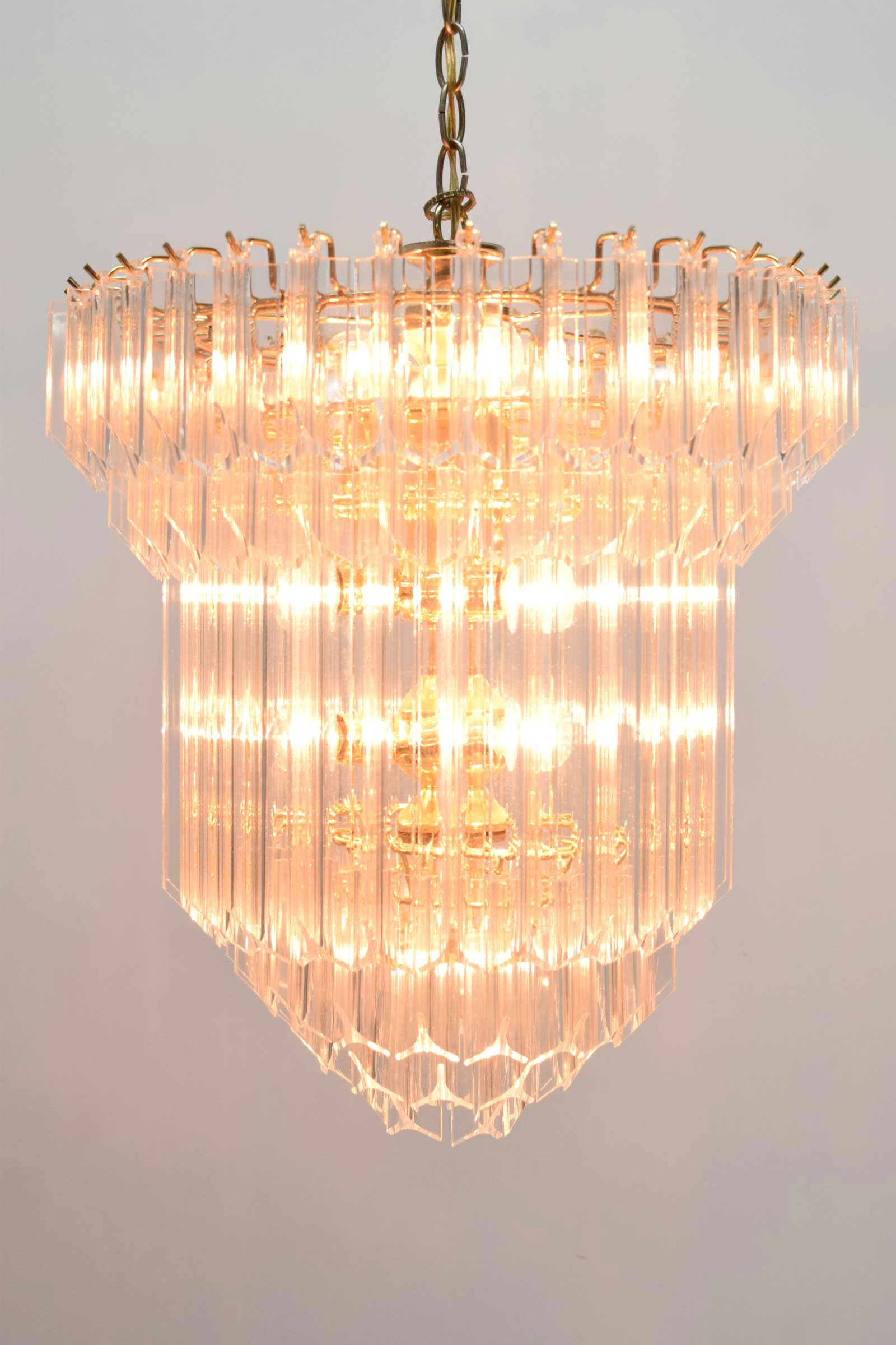 Large Lucite Chandelier, Six Tiers, 1960s: Crafted from very nice lucite, this acrylic chandelier features shimmering acrylic prisms cascading from a wire frame to create a dazzling visual masterpiece. With six tiers illuminating a height of
