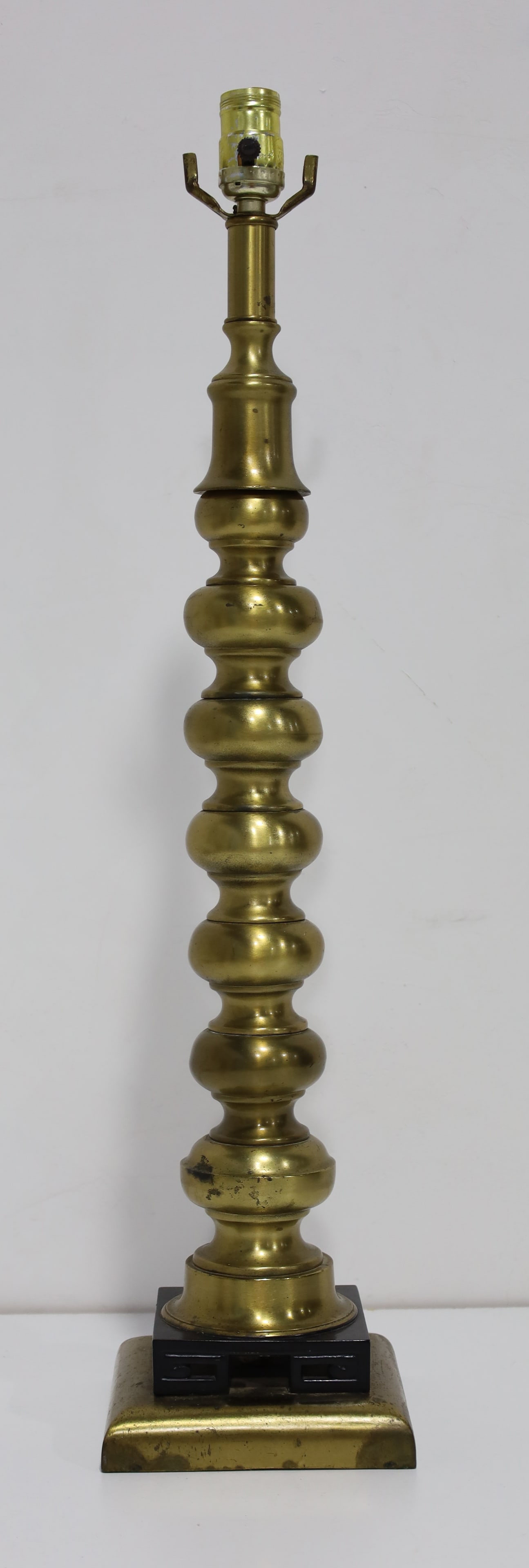 Mutual Sunset Lamp Co. Stacked Ball Chinese Table Lamp: A mid century Mutual Sunset Lamp Company brass stacked ball Chinese style table lamp with black lacquered wood carved base. Sticker on underside.