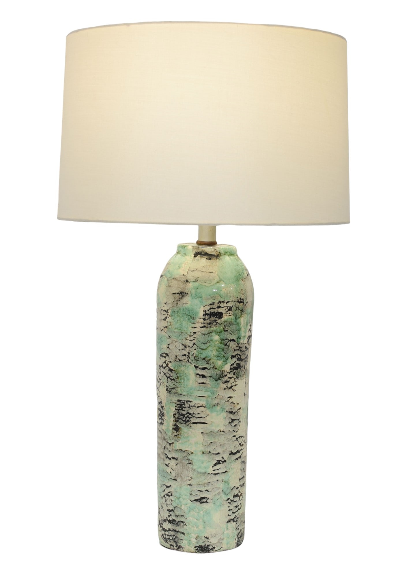 Kelby Ceramic Table Lamp in Black, Green and Off-White Abstract Pattern: This unique lamp by Kelby features a circular drum shape adorned with an abstract design in greens, black, and off-white, perfectly combining bold and neutral tones. The ceramic piece stands at 17.5"