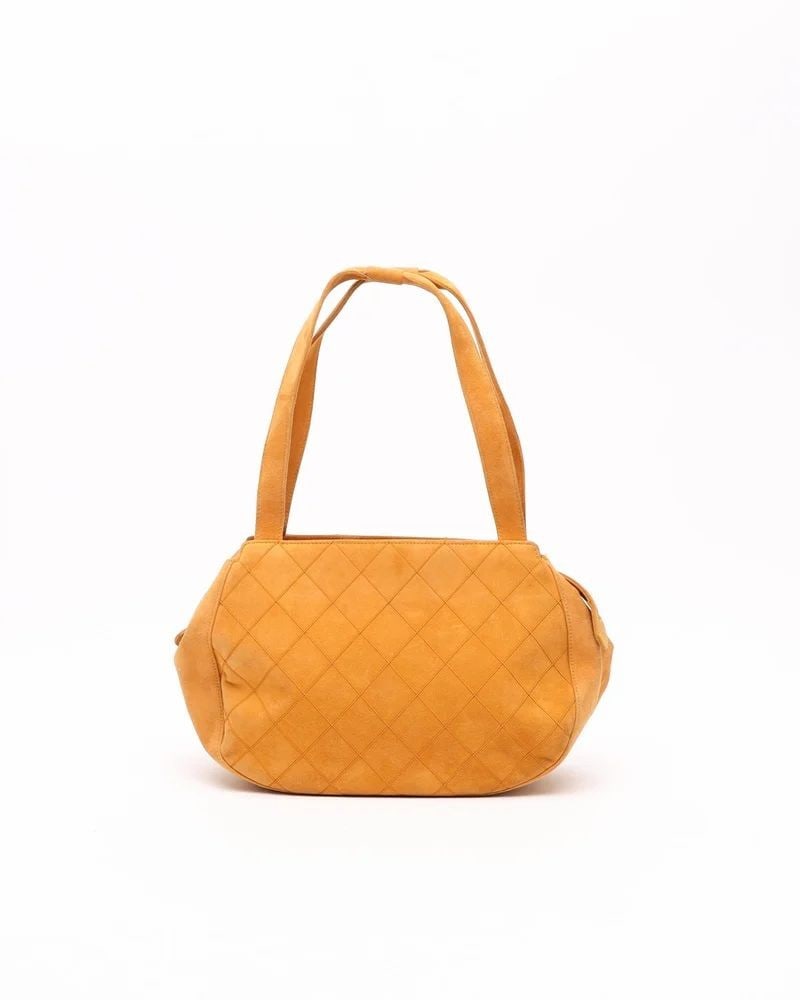 Chanel Orange Matelasse Handbag: Chanel Suede Matelasse Shoulder Bag- Gold-tone hardware - Orange quilted suede- Dual shoulder straps- Brown lining with two pockets - VintageOverall Preloved Condition: Very Good.Exterior Condition: