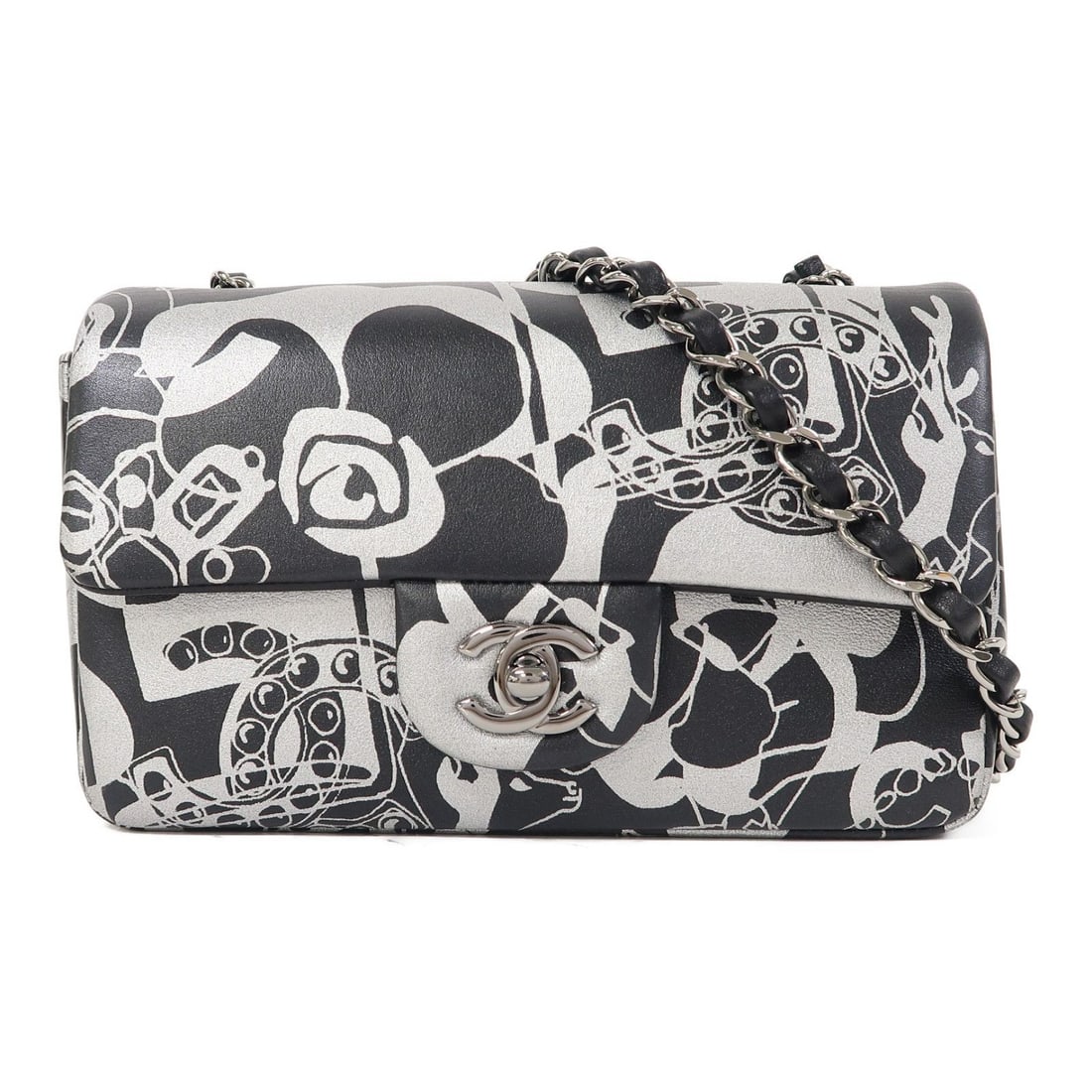 Chanel Black / Silver Mini Rectangular Flap Mini Handbag: Chanel Mini Rectangular Flap Bag in black and silver printed calfskin with a silver chain shoulder strap. Features turn lock closure, exterior and interior pockets.