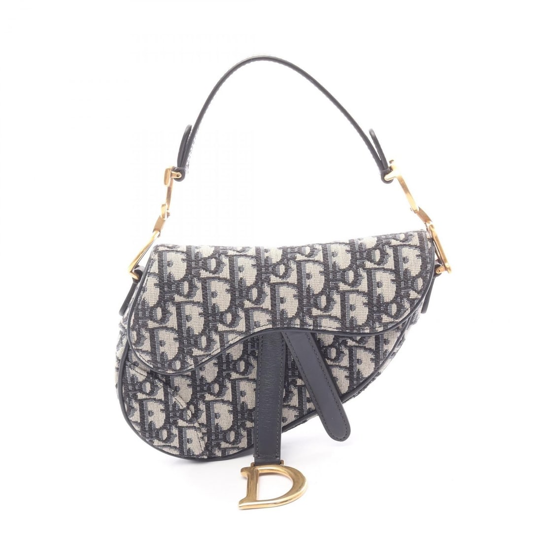 Dior Beige / Navy Canvas Mini Saddlebag Mini Handbag: The Dior Mini Saddlebag is crafted from beige and navy Oblique Jacquard canvas, featuring a structured silhouette with a 34 cm handle.