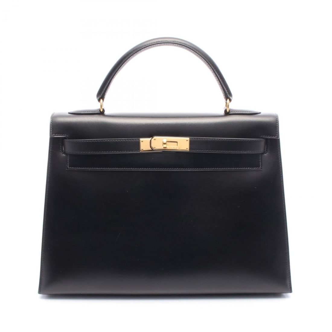Hermès Black Calfskin Kelly 32 32 Handbag: Hermes Kelly 32 handbag in black box calfskin, includes shoulder strap and key cadena. Dimensions: 32cm L x 23cm H x 12cm D.