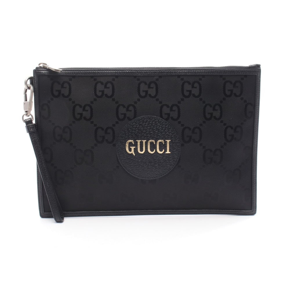 Gucci Off The Grid Clutch: Gucci Off The Grid GG pattern clutch bag in black nylon canvas and leather.