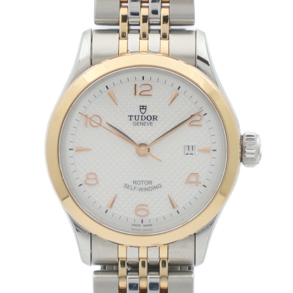 Tudor 1926 Watch: Tudor 1926 91351 automatic watch in 18K yellow gold and stainless steel with silver dial.