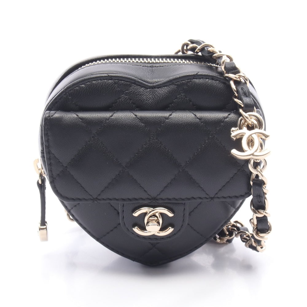 Chanel Heart Chain Clutch Bag: Chanel Heart chain clutch bag in black leather with gold hardware.