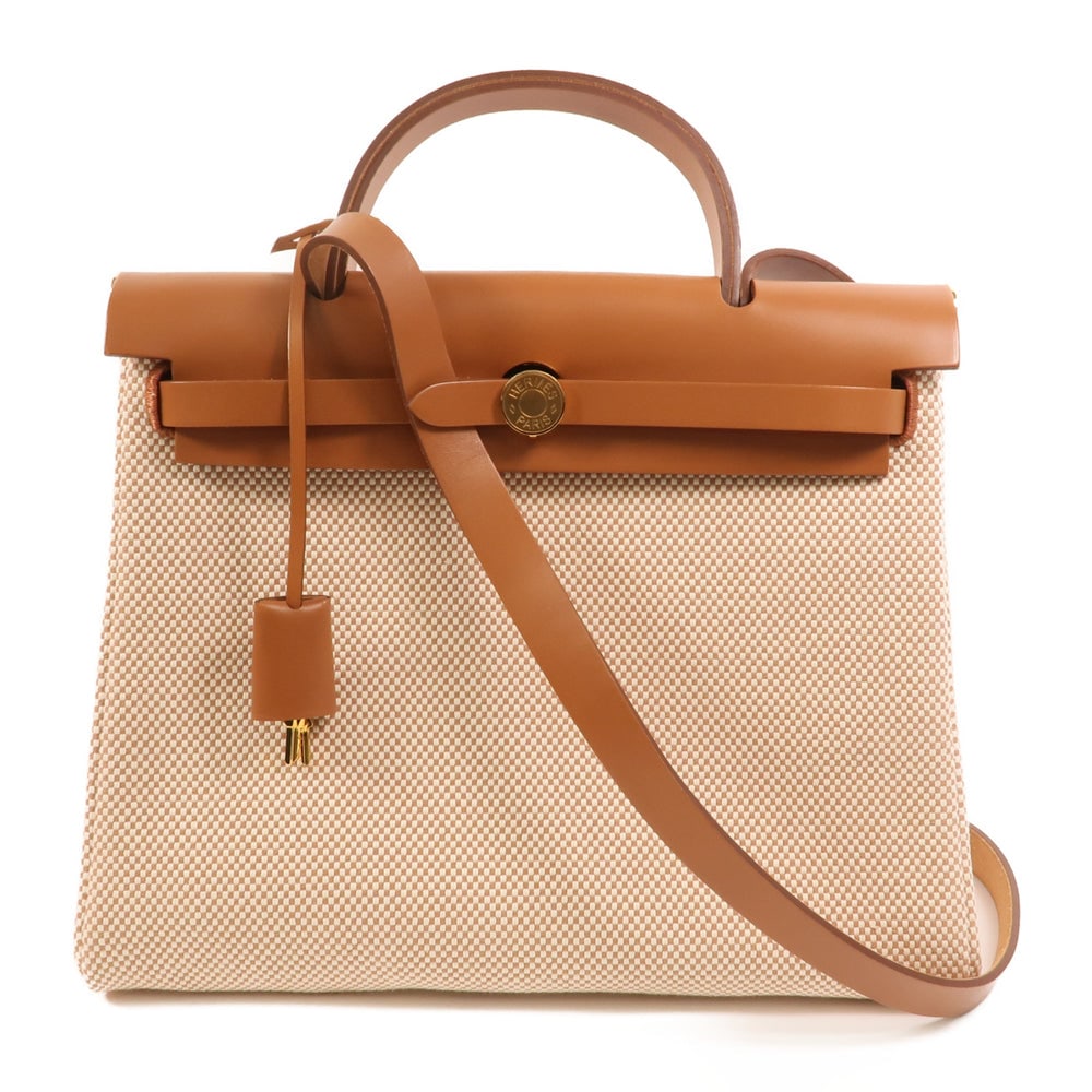 Hermes Herbag PM 2WAY: Hermes Herbag PM 2WAY shoulder bag in brown and beige canvas with gold hardware.