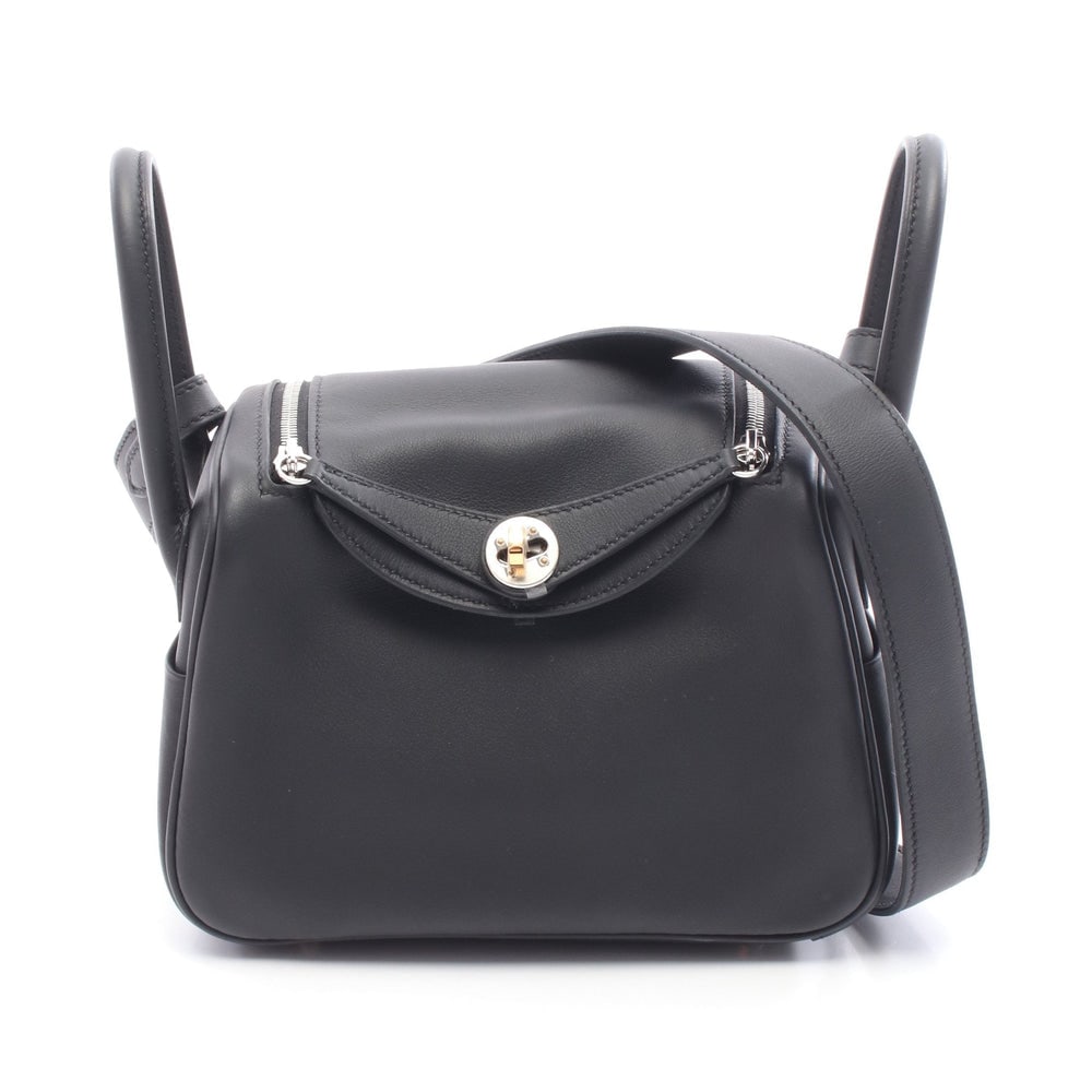 Hermes Lindy Mini Shoulder Bag: Hermes Lindy Mini shoulder bag in black Veau Swift with Electrum fittings K stamp.