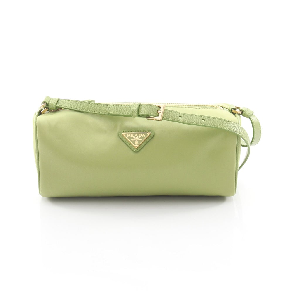 Prada Re-Nylon Pouch Light Green: Light green nylon and saffiano leather shoulder pouch. Model 1NE058. 22 x 8.5 x 7.5 cm.