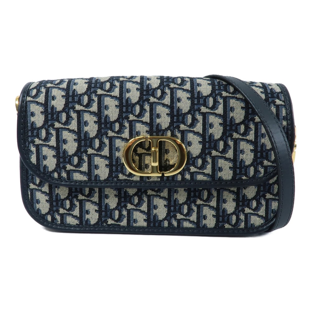 Dior 30 Montaigne Avenue Navy: Navy canvas shoulder bag. Includes storage bag and guarantee. 23 x 13 x 5.5 cm.