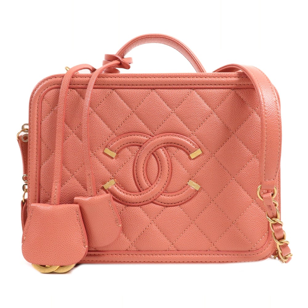 Chanel Vanity Case 2Way Pink: Pink calfskin vanity case 2Way shoulder handbag. Includes storage bag hologram guarantee clochette key and cadena. 21 x 16 x 7.5 cm.