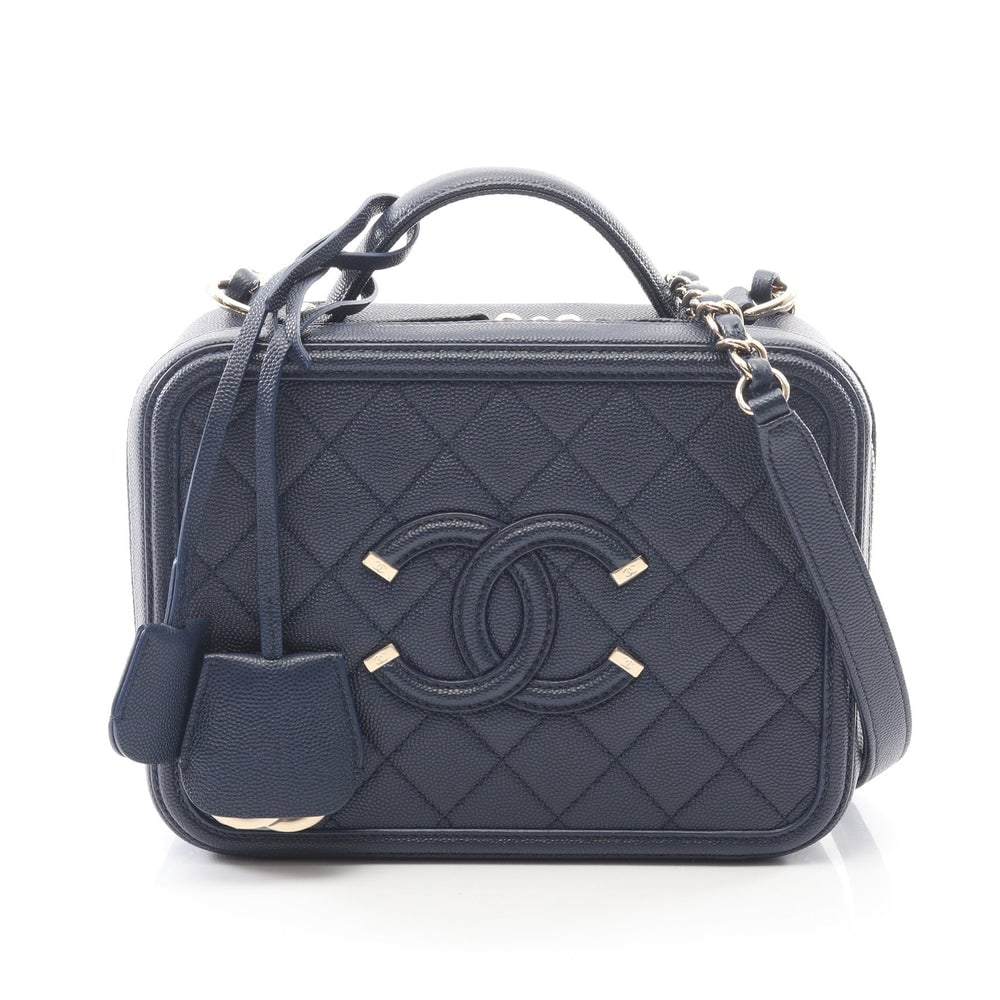 Chanel Filigree Vanity Blue: Dark blue caviar skin vanity chain shoulder bag. Includes guarantee card keys crochet and padlock. 24 x 18 x 10 cm.