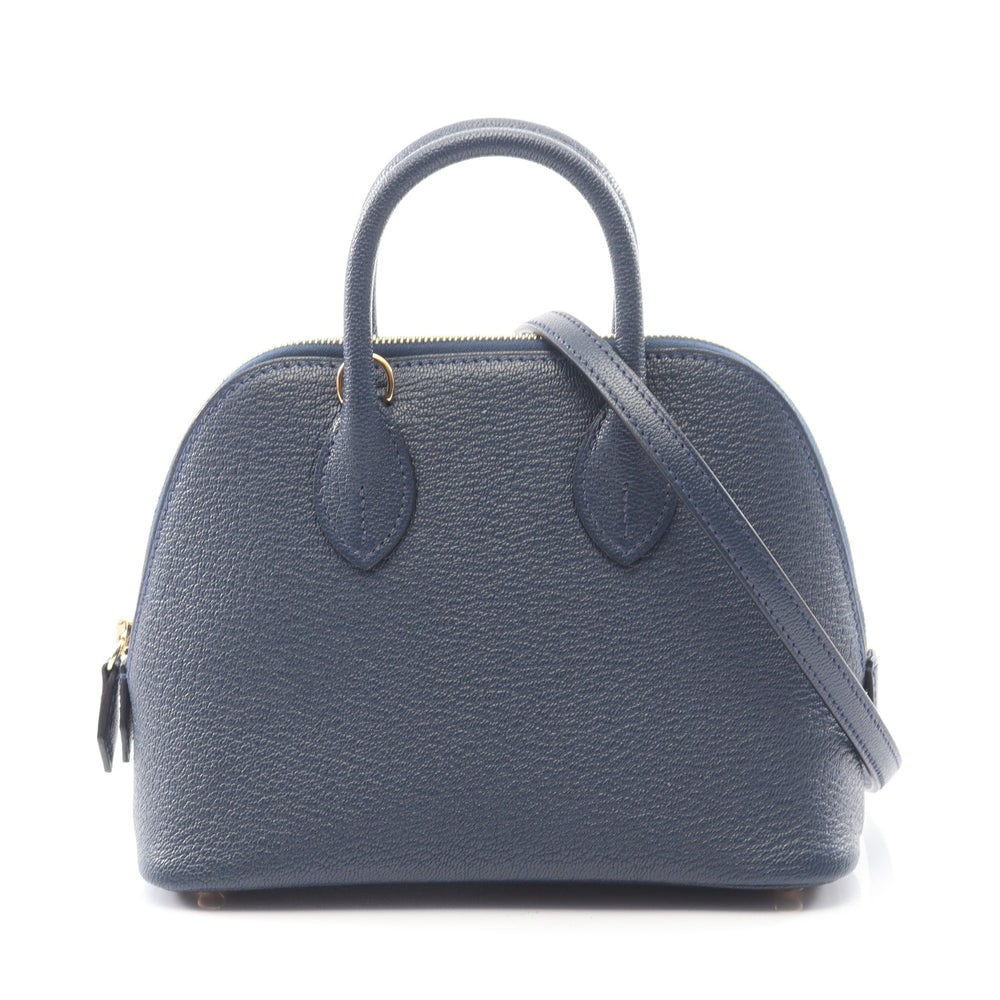 Hermes Bolide 1923 Mini Navy: Navy chevre 2Way handbag with gold hardware. Includes box storage bags and shoulder strap. 17.5 x 13.5 x 7.5 cm.