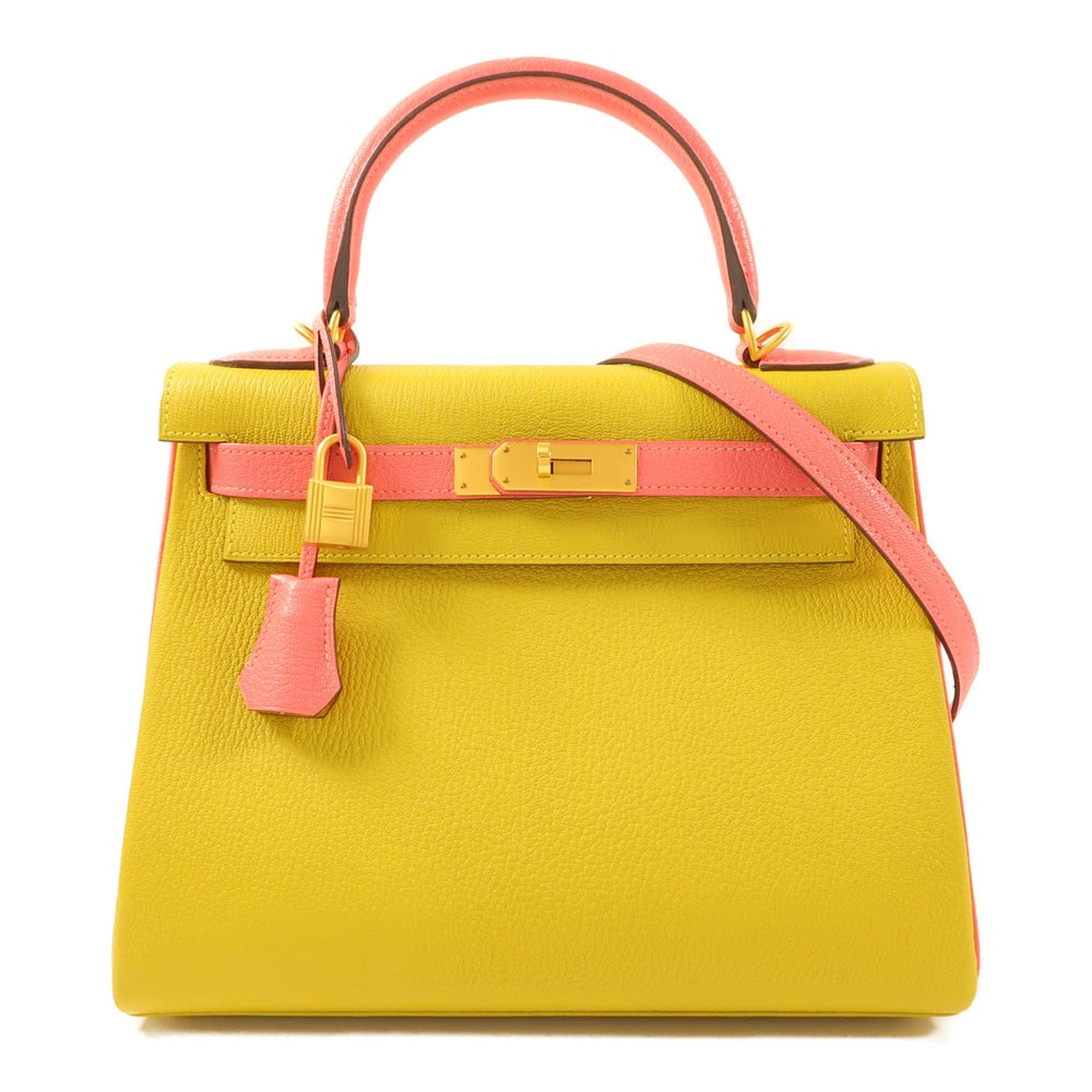 Hermes Kelly 28 Rose Azalee: Rose Azalee and jaune ambre chevre leather 2Way shoulder bag with gold hardware. 28 x 20 x 11 cm.